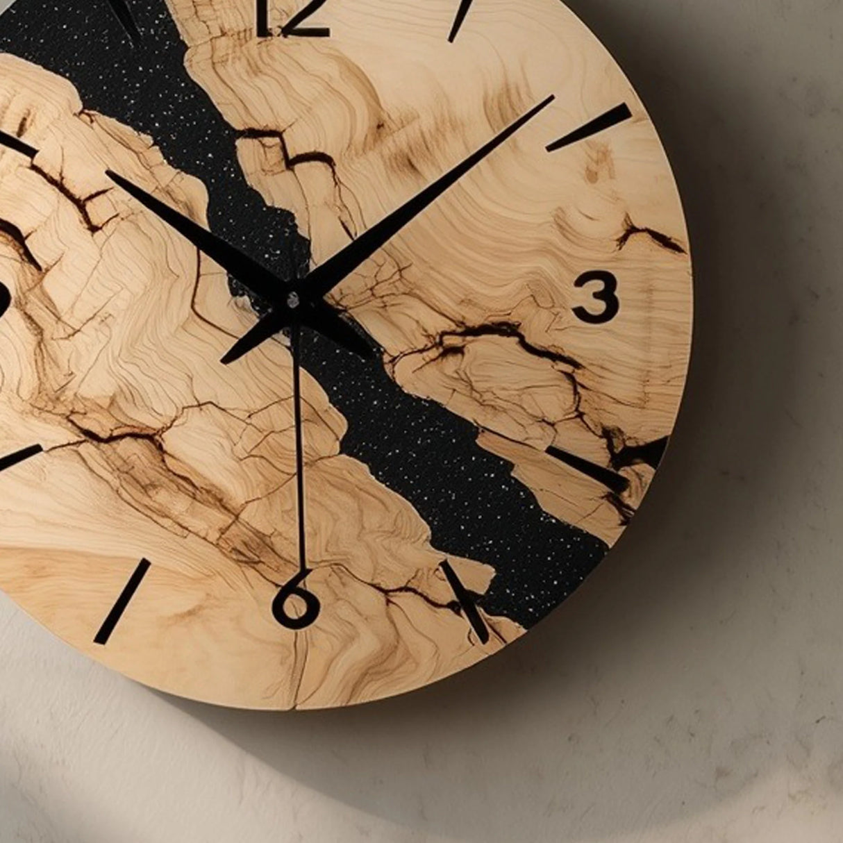 Marbled pattern circular wooden wall clock close up showing dial and texture detail
