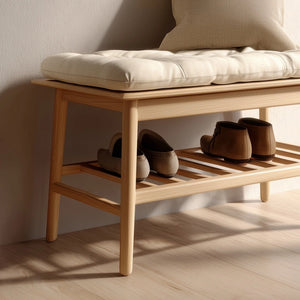 Angled view of wooden entry bench showing cushioned top and open storage shelf