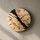 Marbled pattern circular wooden wall clock with black accent