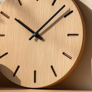 Minimal round wooden table clock with line markers close up showing dial and hands