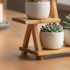 Multi level wooden display stand for small decor close up showing tiered structure