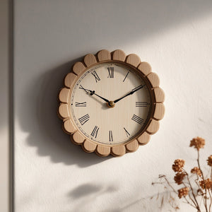 Round wooden wall clock with scalloped frame mounted on neutral wall