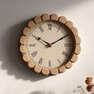 Round wooden wall clock with scalloped frame